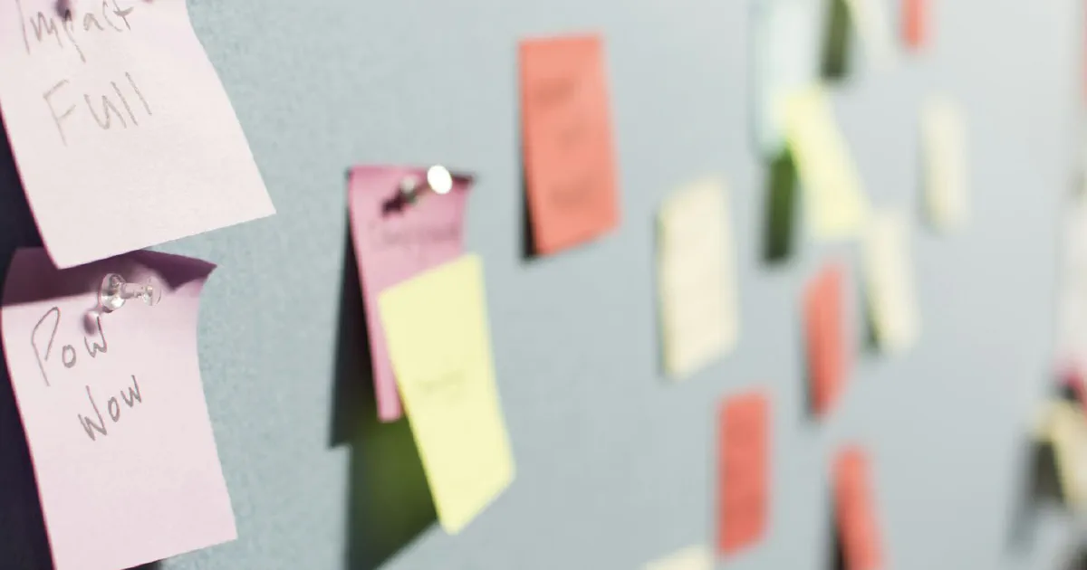 Colorful sticky notes pinned to a board