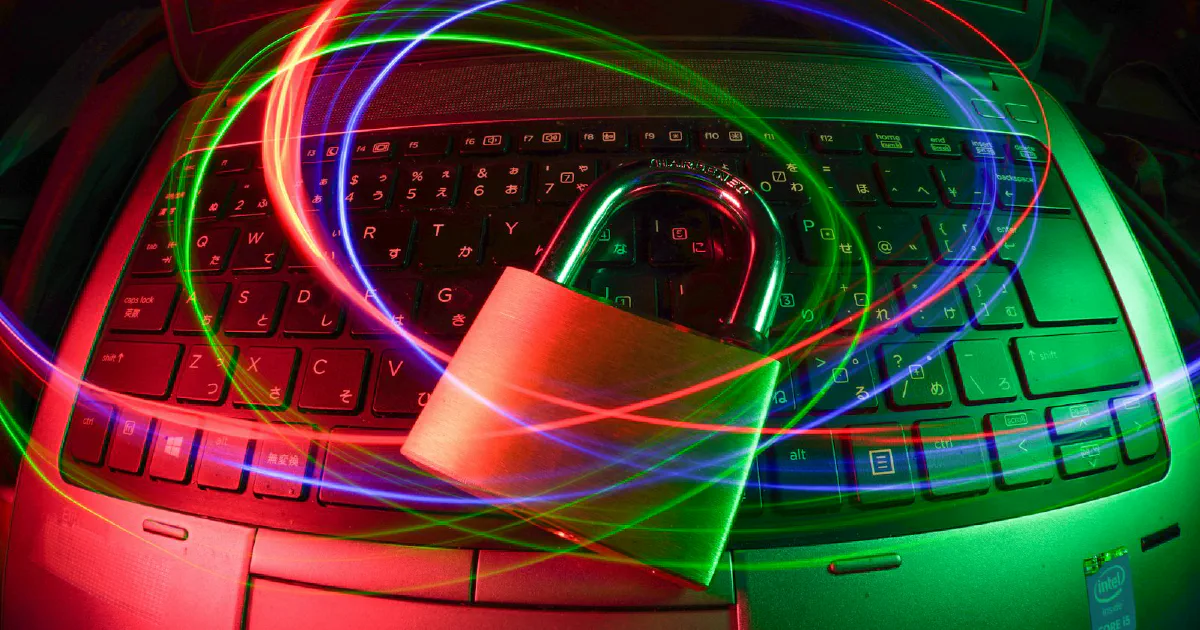 Padlock on a laptop with light trails
